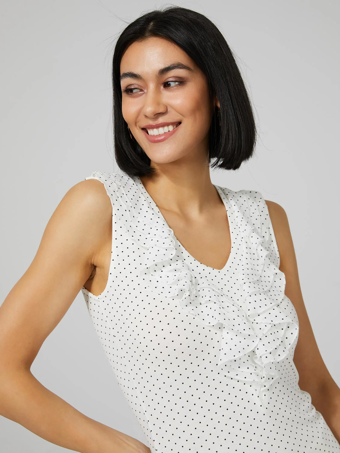 Polka Dot Sleeveless Top With Chiffon Ruffle Detail